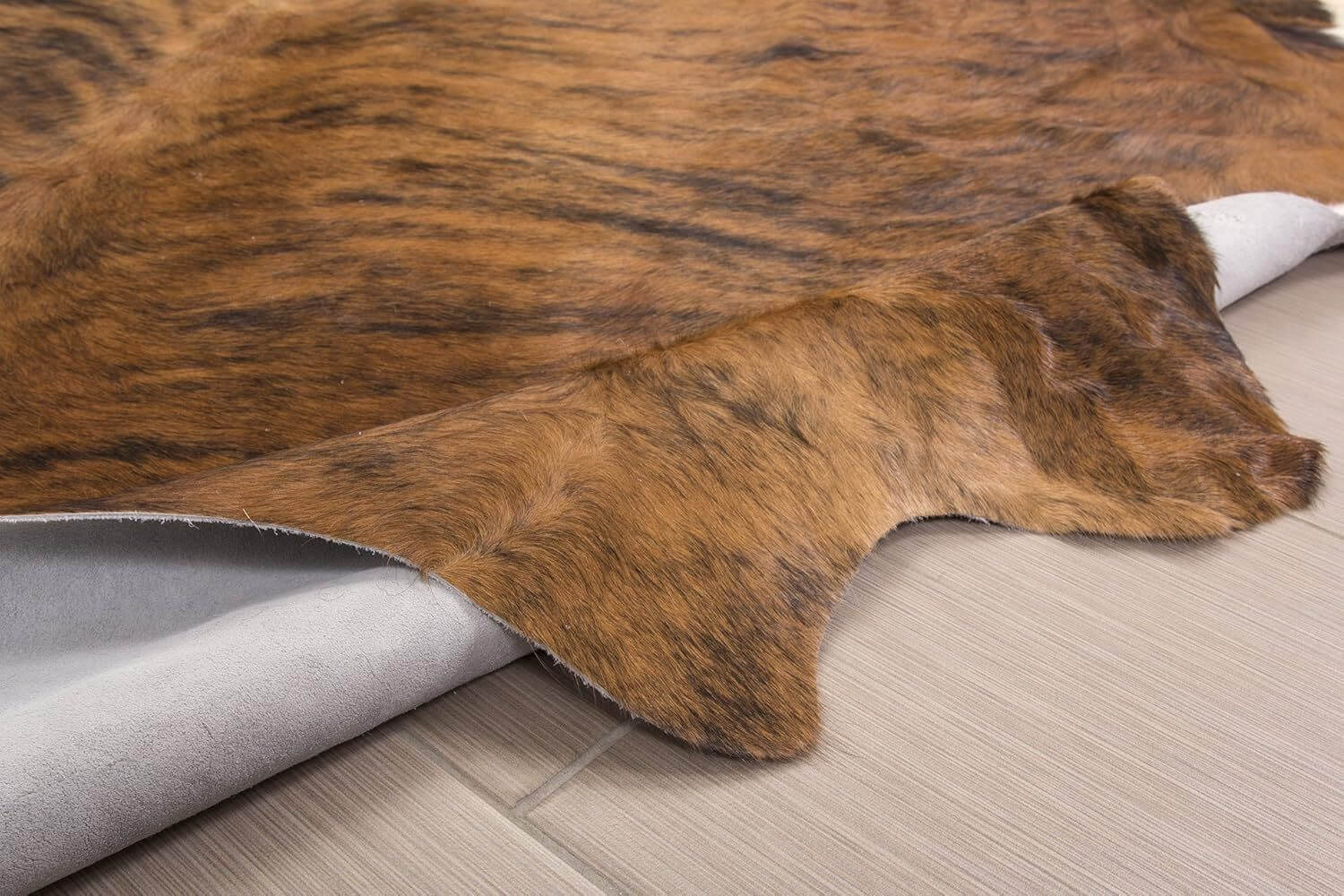 brown cowhide rug front and back